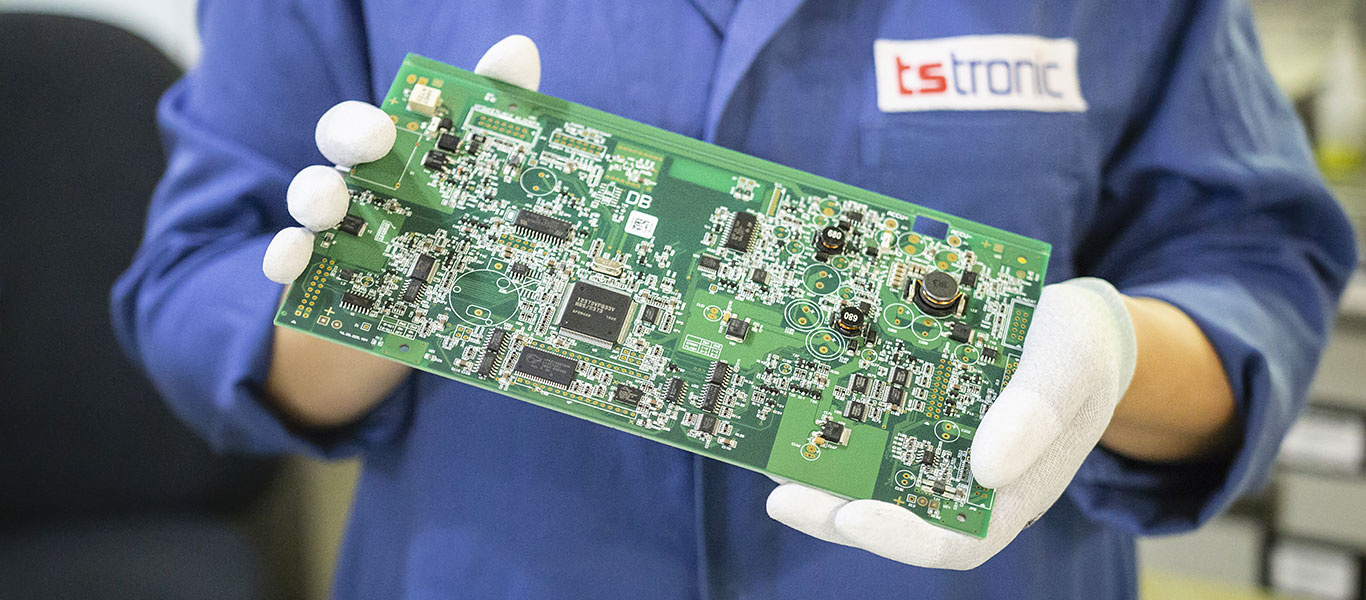 Person holding a PCB board