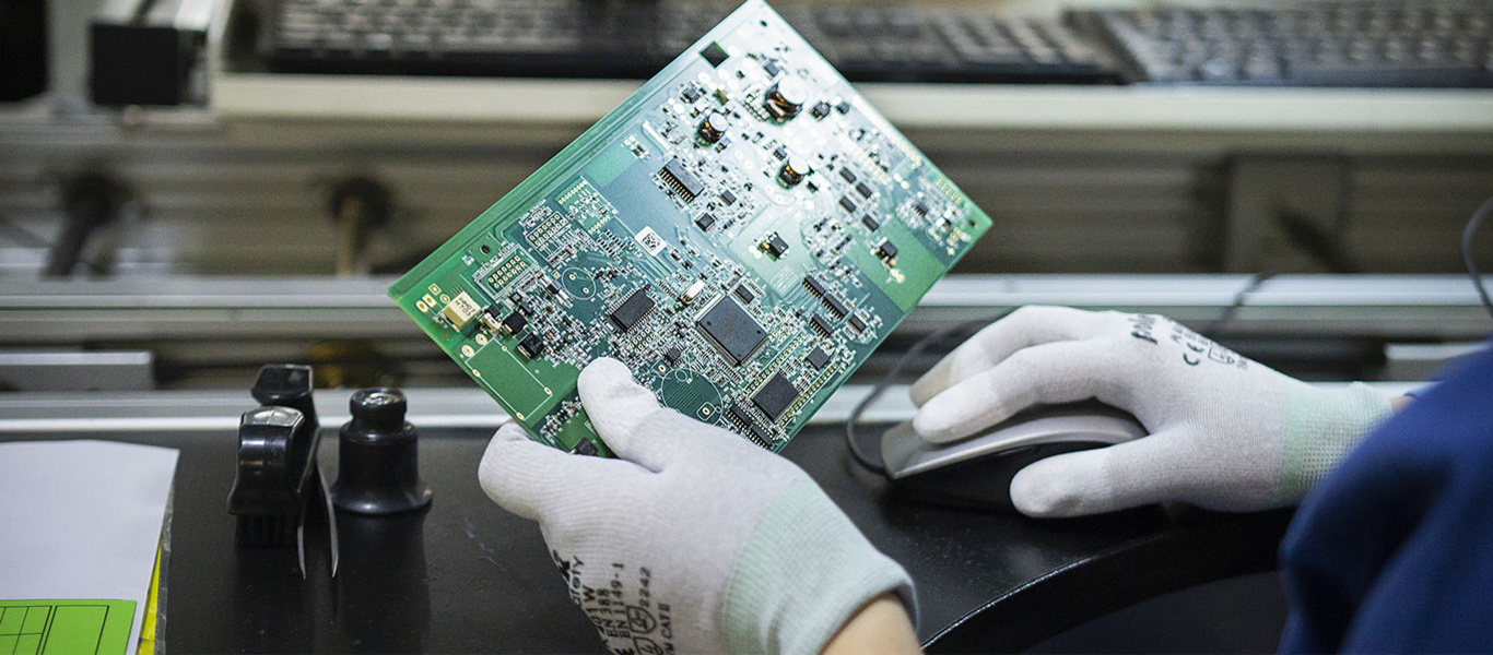 Person holding a PCB board